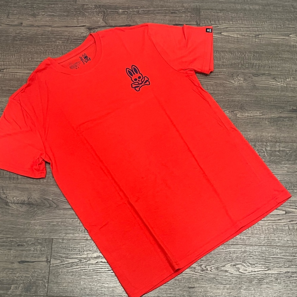 Psycho Bunny orange classic logo tee. Size Large